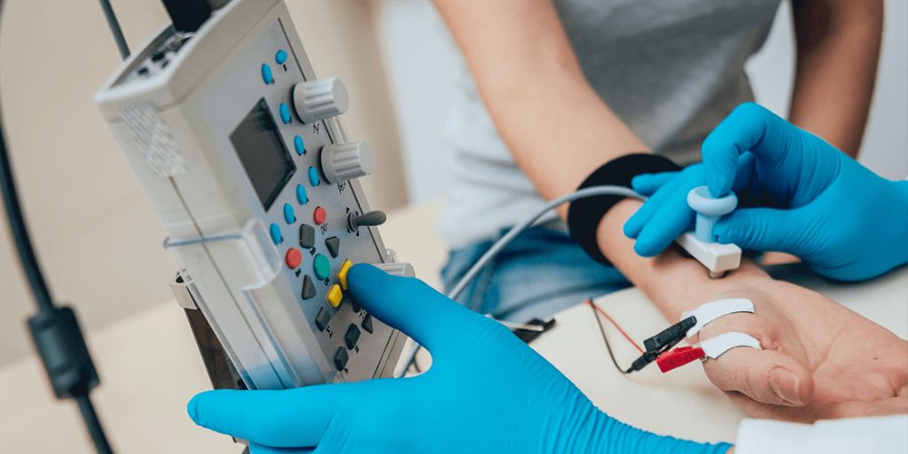 A patient undergoing nerve conduction study